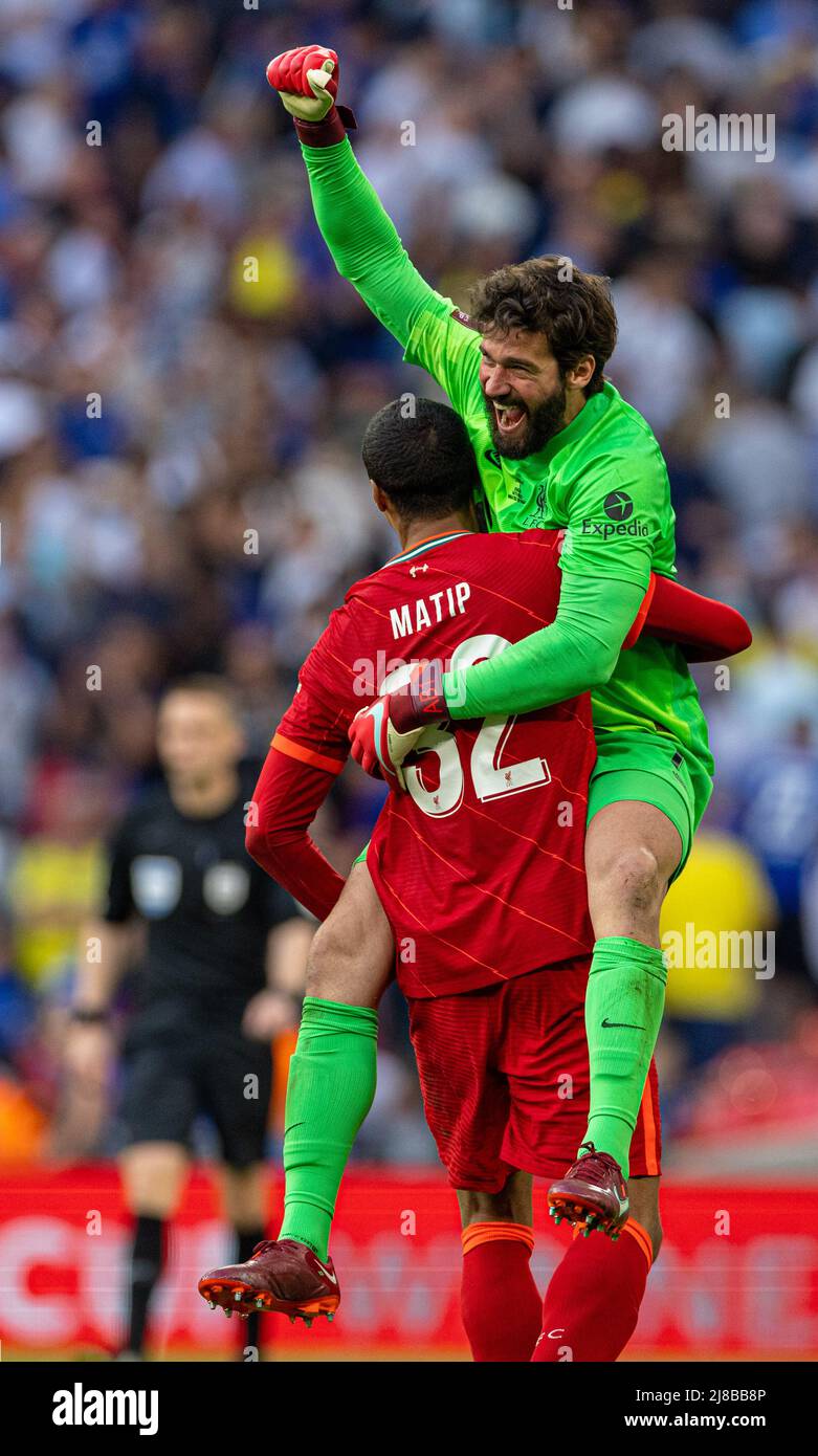 (220515) -- LONDON, May 15, 2022 (Xinhua) -- Liverpool's goalkeeper Alisson Becker (Top) celebrates with teammate Joel Matip after winning the FA Cup Final match between Chelsea and Liverpool at Wembley Stadium in London, Britain, on May 14, 2022. Liverpool won 6-5 on penalties after a goalless draw. (Xinhua) FOR EDITORIAL USE ONLY. NOT FOR SALE FOR MARKETING OR ADVERTISING CAMPAIGNS. NO USE WITH UNAUTHORIZED AUDIO, VIDEO, DATA, FIXTURE LISTS, CLUB/LEAGUE LOGOS OR 'LIVE' SERVICES. ONLINE IN-MATCH USE LIMITED TO 45 IMAGES, NO VIDEO EMULATION. NO USE IN BETTING, GAMES OR SINGLE CLUB/LEAGUE/PLAYE Stock Photo