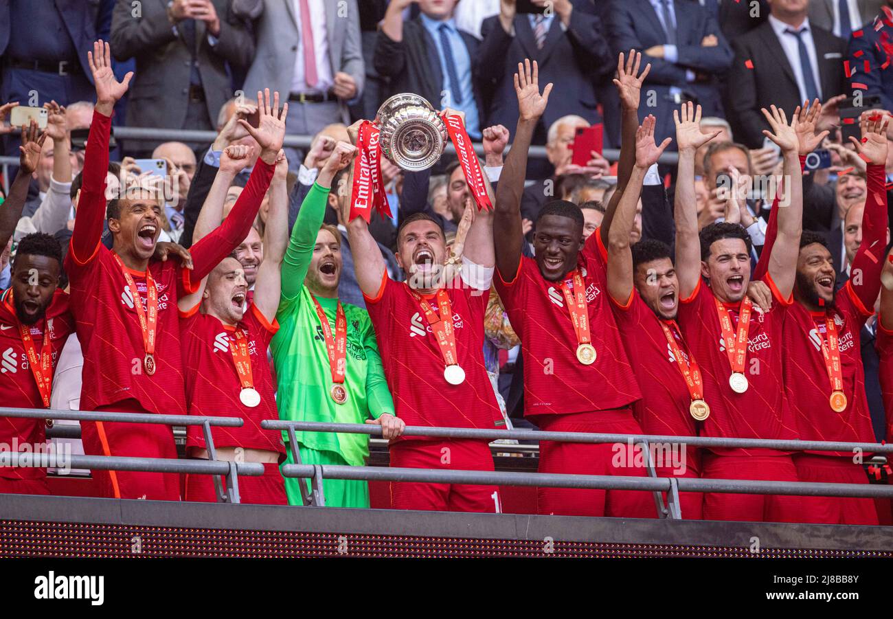 London, UK. 15th May, 2022. Liverpool's players celebrate with the trophy after winning the FA Cup Final match between Chelsea and Liverpool at Wembley Stadium in London, Britain, on May 14, 2022. Liverpool won 6-5 on penalties after a goalless draw. Credit: Xinhua/Alamy Live News Stock Photo