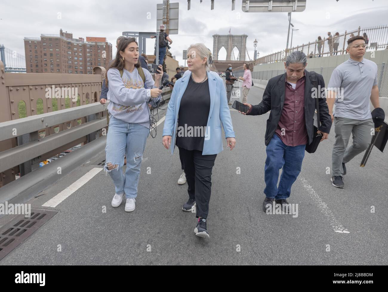 NEW YORK, N.Y. – May 14, 2022: Senator Kirsten Gillibrand, middle-left, marches across the Brooklyn Bridge during an abortion rights protest. Stock Photo