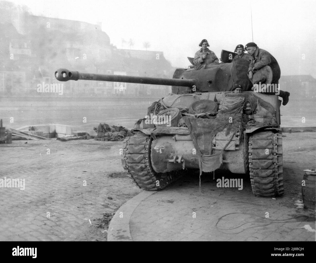 British Sherman Tank, known as the Firefly patrolling the Meuse at Namur during the German Ardennes counter-offensive (known as Battle of the Bulge) in 1944 during World War 2 Stock Photo