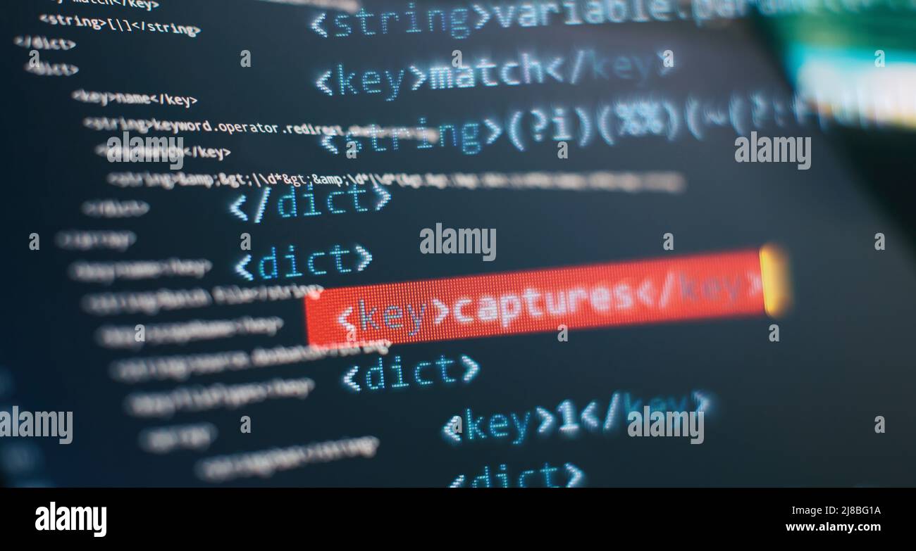 Website HTML Code on the Laptop Display Closeup Photo. Modern tech. Innovative startup project. Stock Photo
