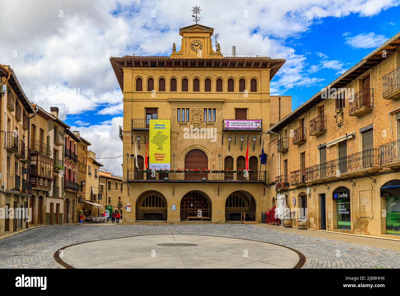 Olite, Spain - June 23, 2021: City Council building and medieval houses on Plaza de los Teobaldos square in the town famous for a Royal Palace castle Stock Photo