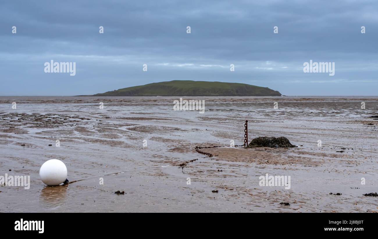 Low tide over Balcary Bay with Heston Island and Balcary Tower in the background, Auchencairn, Scotland Stock Photo
