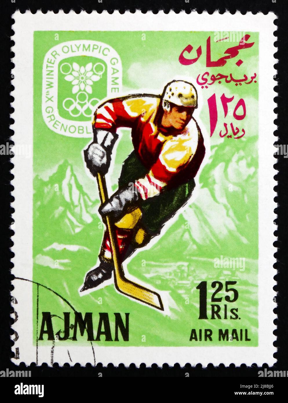 AJMAN - CIRCA 1967: a stamp printed in the Ajman shows Ice Hockey, Winter Olympics 68, Grenoble, circa 1967 Stock Photo