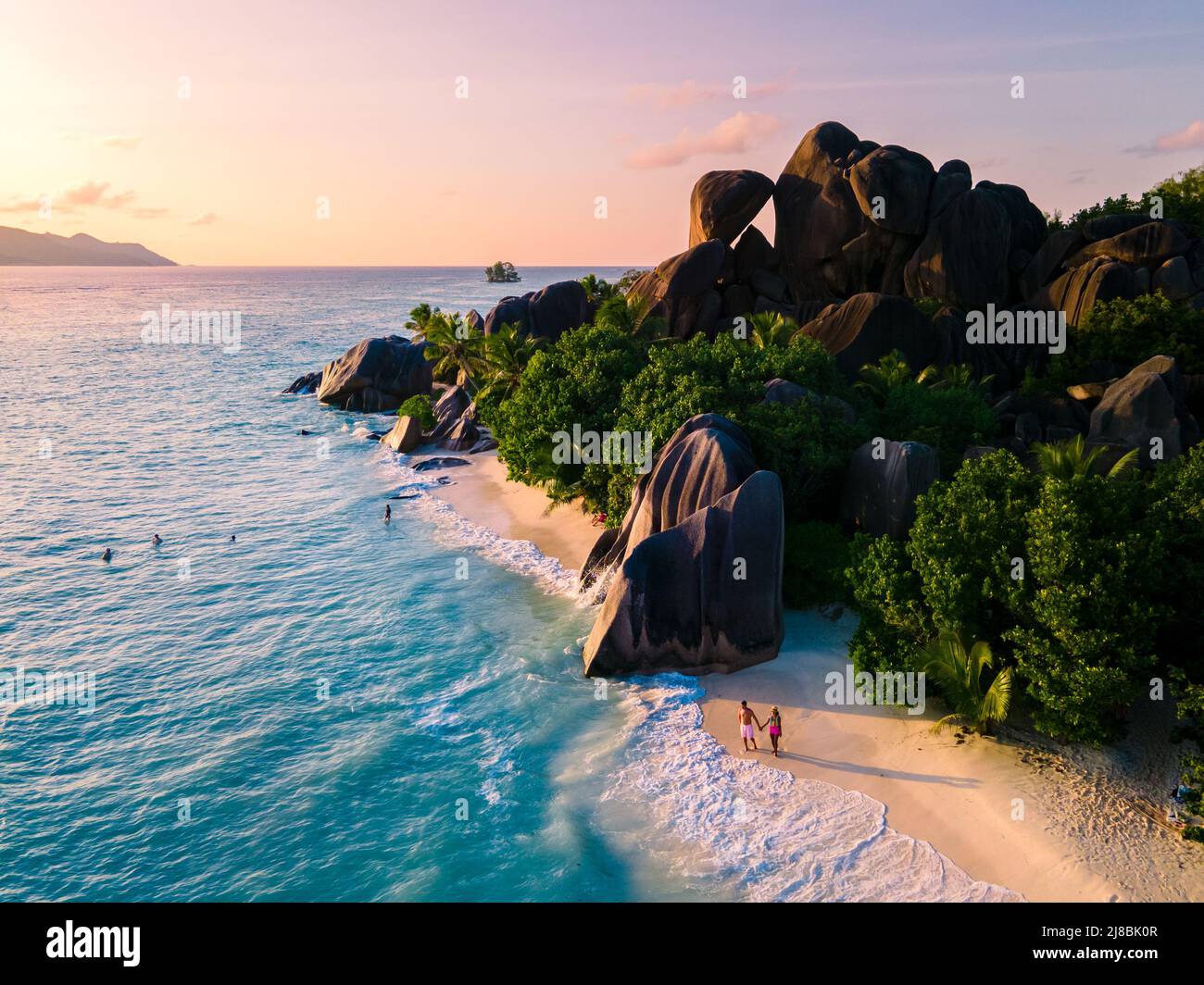 Anse Source d'Argent, La Digue Seychelles, a young couple of men and