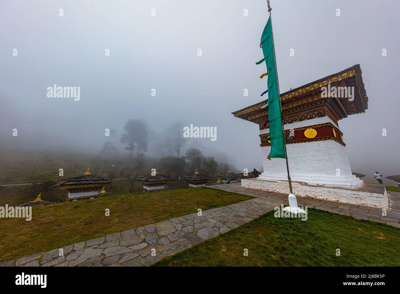 Bhutan, October 26, 2021: Druk Wangyal, Bhutan, 108 chorten or stupas, memorial in honor of the Bhutanese soldiers at the Dochula Pass. Cloudy foggy d Stock Photo