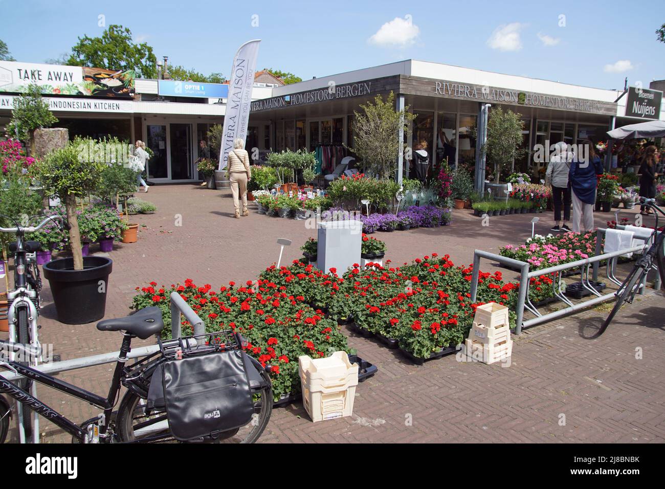 Dutch flower market with many plants for sale outside. Plants, shrubs