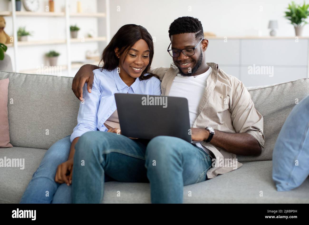 African american couple using laptop hi-res stock photography and ...