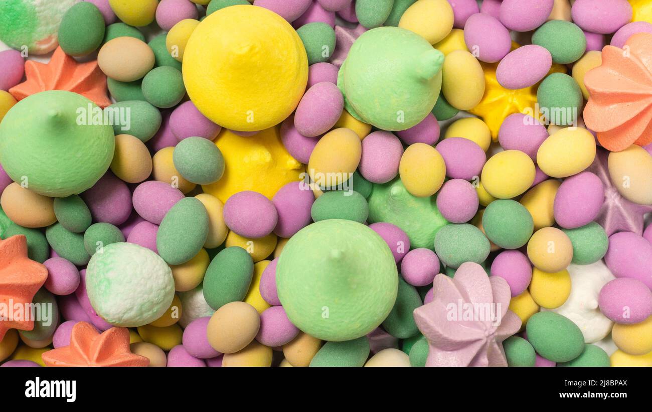 Colorful Peanuts Colorful meringues and glazed peanuts isolated on a white background ...