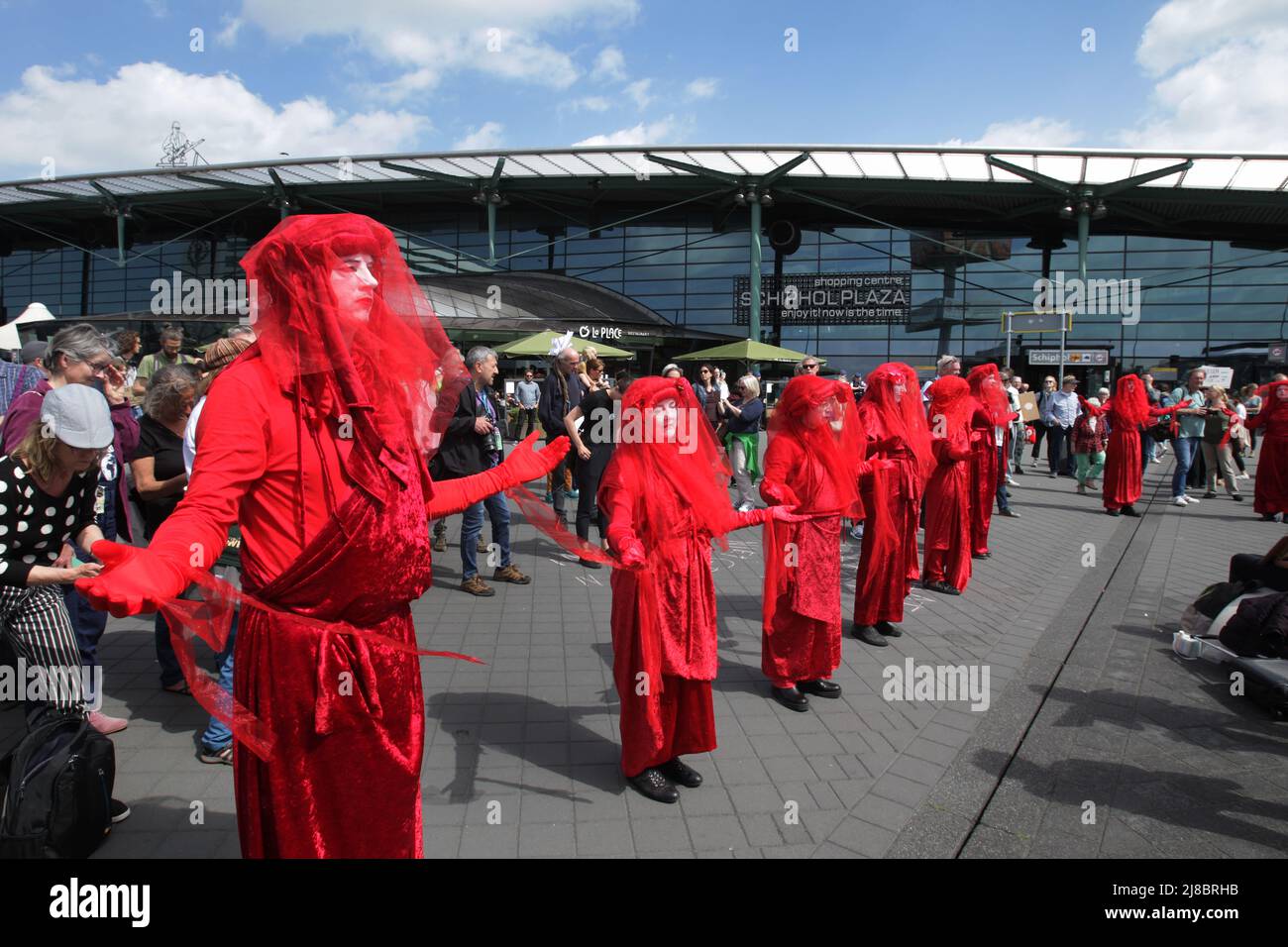 Environmental activists Extinction Rebellion Red Rebells group protest at the Schiphol Airport on May 14, 2022 in Amsterdam,Netherlands. Environmental Stock Photo