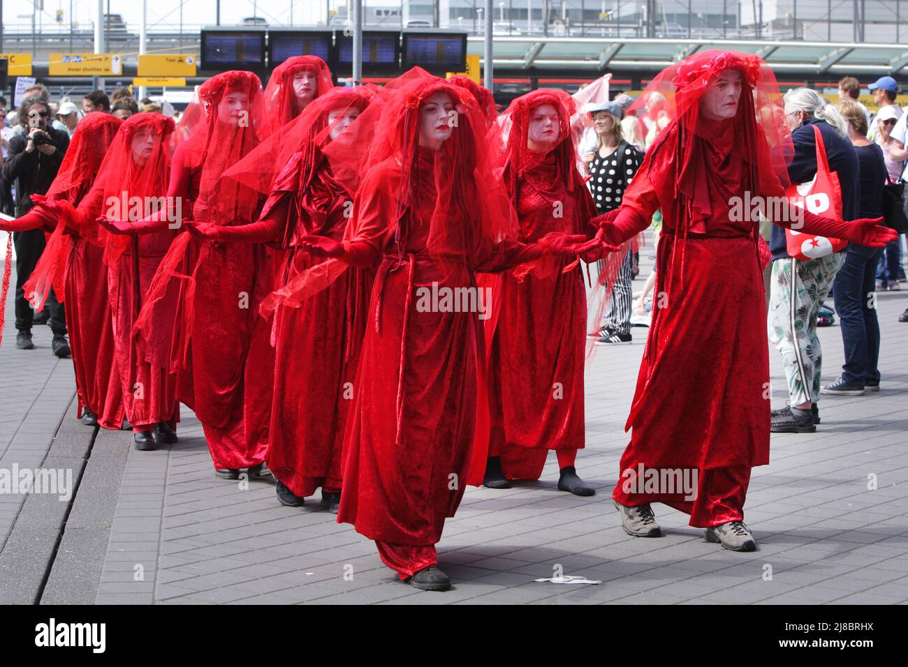 Environmental activists Extinction Rebellion Red Rebells goup protest at the Schiphol Airport on May 14, 2022 in Amsterdam,Netherlands. Environmental Stock Photo