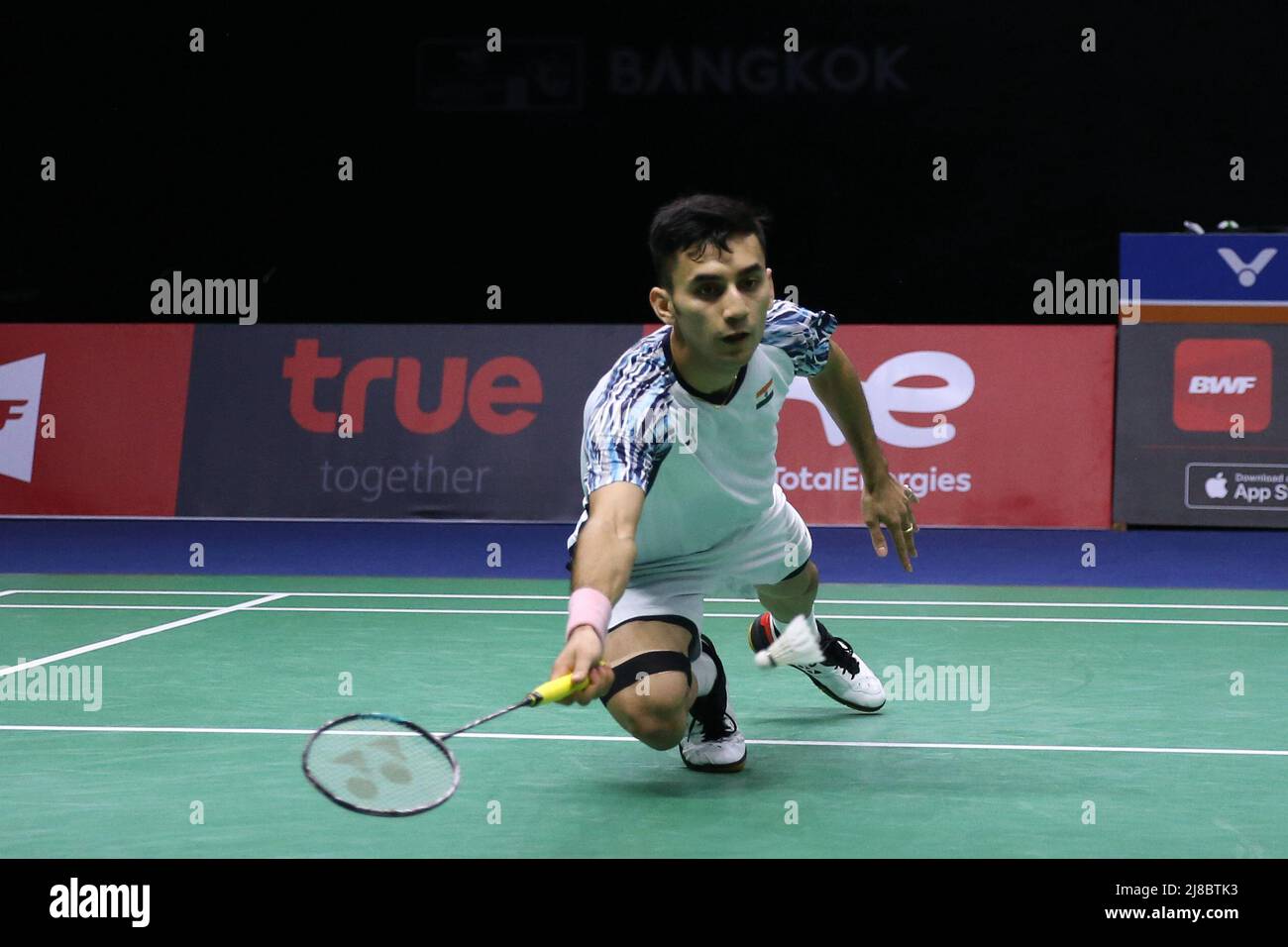 220515) -- BANGKOK, May 15, 2022 (Xinhua) -- Lakshya Sen of India competes in the singles match against Anthony Sinisuka Ginting of Indonesia during the final match at Thomas Cup badminton tournament