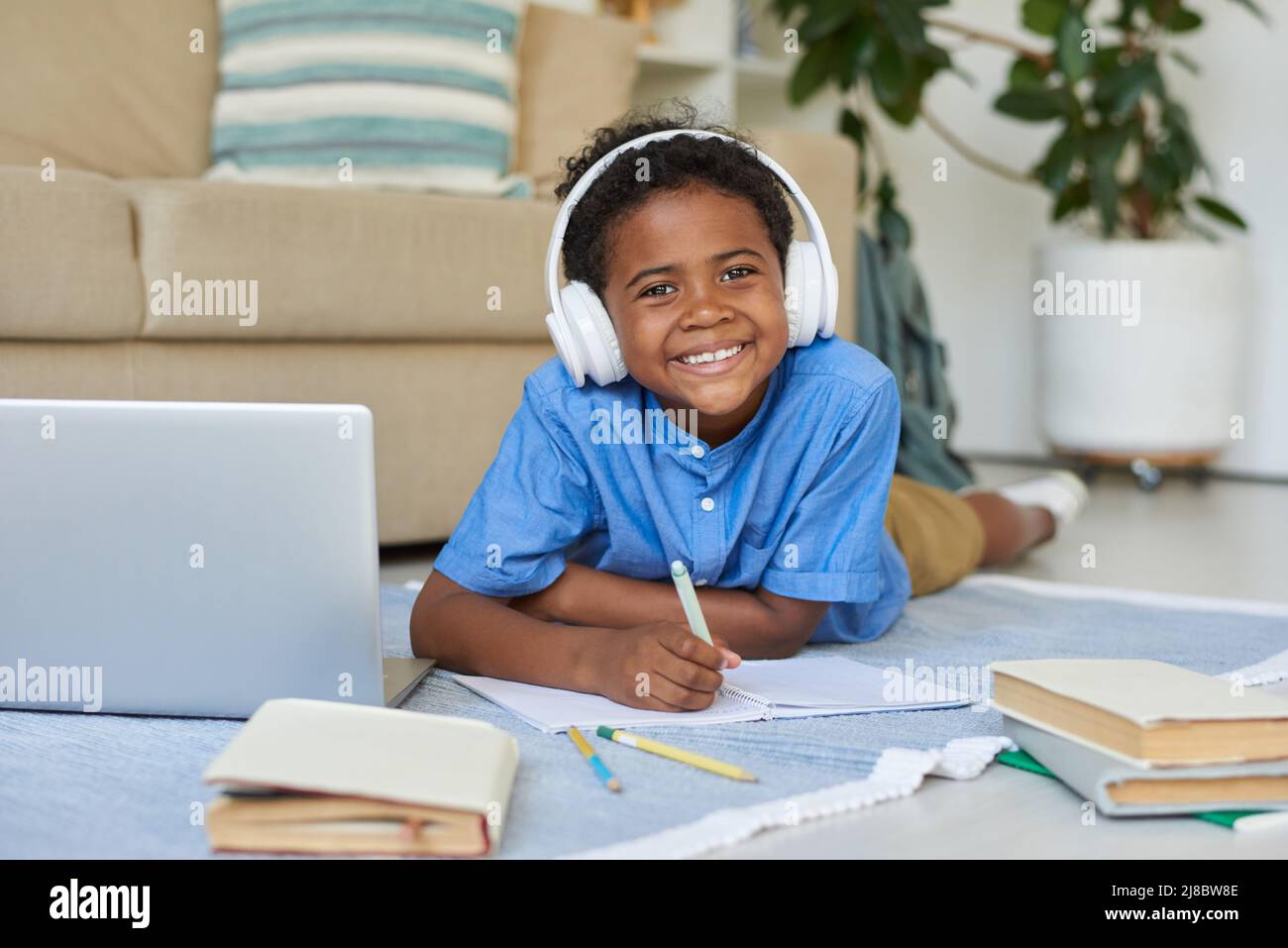 African boy sitting on floor hi-res stock photography and images - Alamy