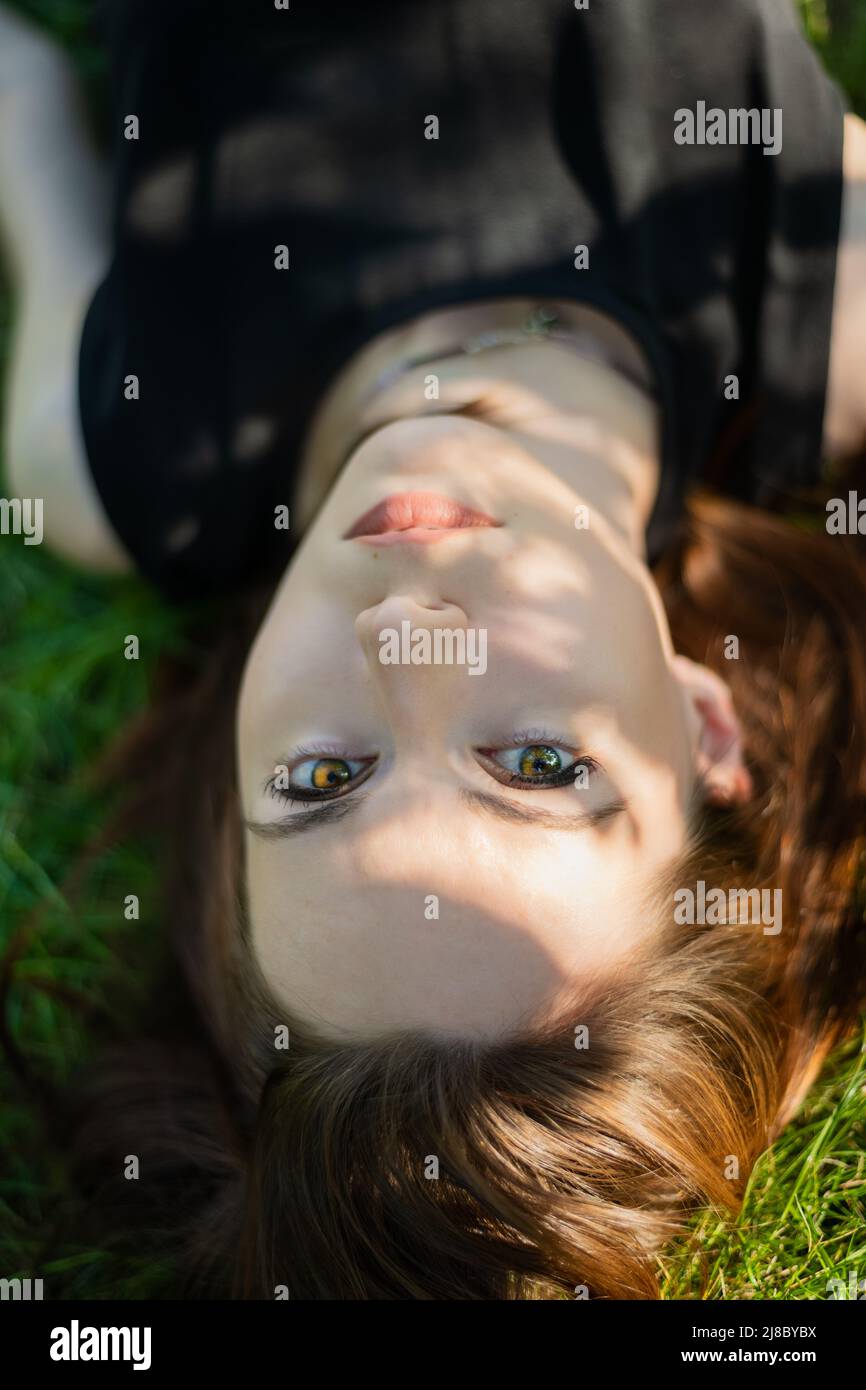 Portrait of beautiful young woman in the park Stock Photo - Alamy
