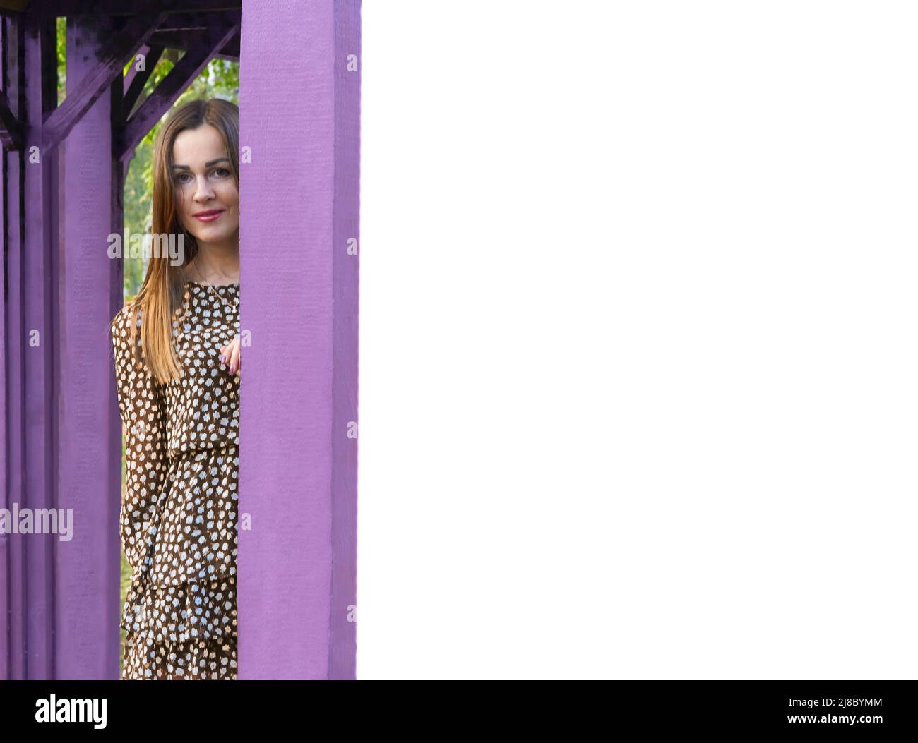 Place for text on a purple stand with a charming fair haired girl in nature Stock Photo