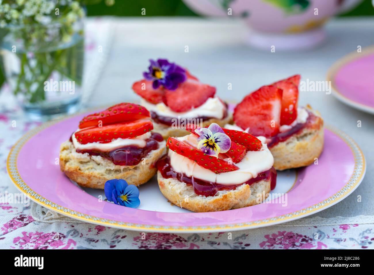 Traditional english afternoon tea with selection of cakes and sandwiches Stock Photo