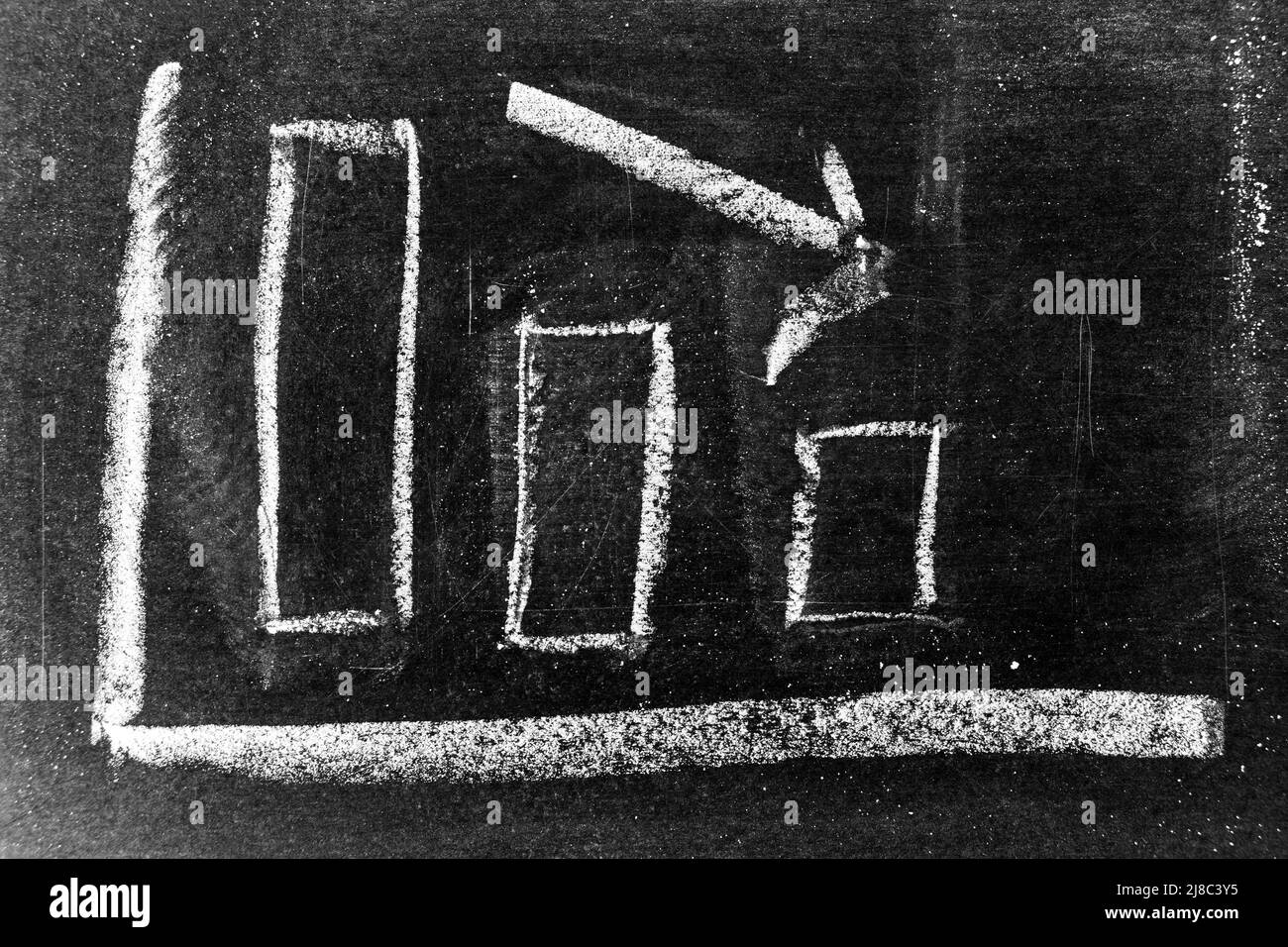 chalk board with sketch of decreasing business graph... White chalk hand drawing in arrow down shape on blackboard or ...