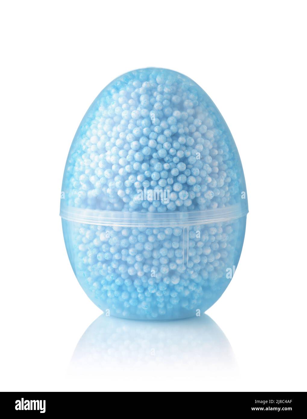 Front view of transparent egg container of blue modelling foam beads isolated on white Stock Photo