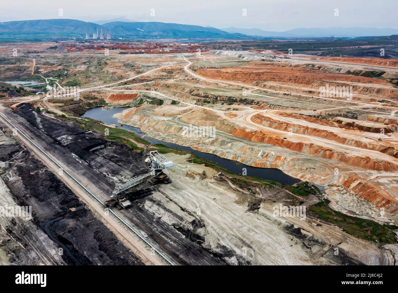 View into the opencast lignite mine in the lignite mining area near Ptolemaida, Greece. Aerial View Stock Photo