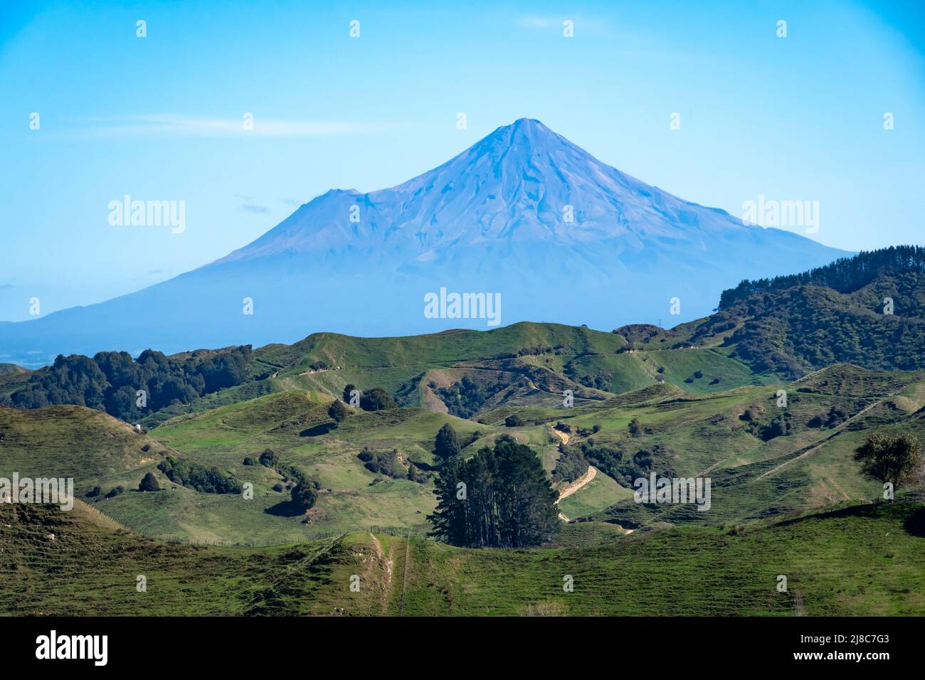 Mount Taranaki, hills and farmland, from Strathmore Saddle, near Stratford, Taranaki, North Island, New Zealand Stock Photo