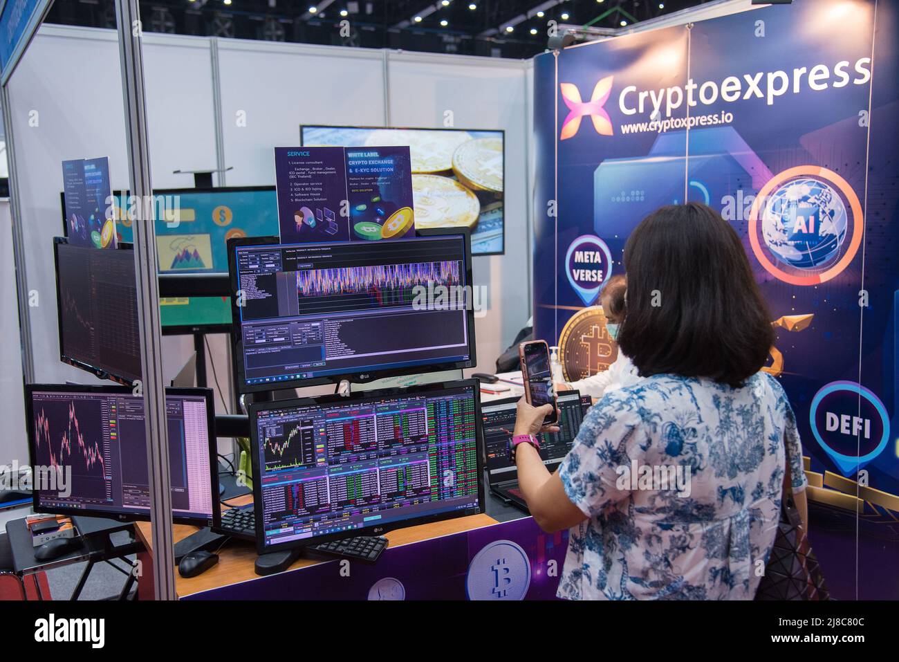 A visitors seen taking a photo of technical analysis charts at Thailand  Crypto Expo 2022 at Bangkok International Trade & Exhibition Centre  (BITEC). The Thailand Crypto Expo 2022 is the first cryptocurrency