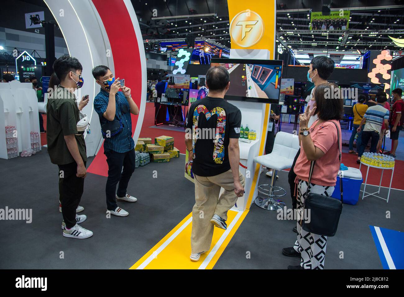 A visitor seen playing a game to earn cryptocurrency by exercising at  Thailand Crypto Expo 2022 at Bangkok International Trade & Exhibition  Centre (BITEC). The Thailand Crypto Expo 2022 is the first