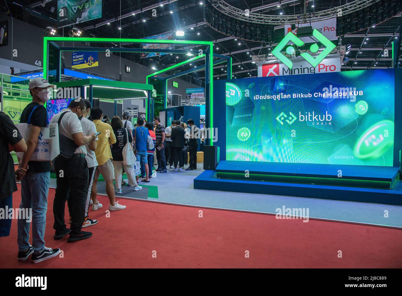 Visitors queue up to try the Play to Earn crypto game at 