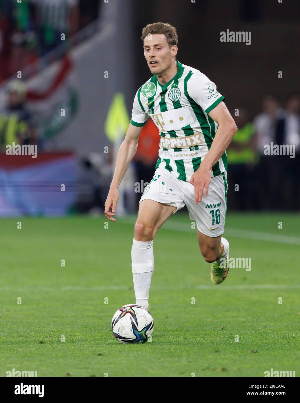 BUDAPEST, HUNGARY - JULY 13: Aleksa Amanovic of FC Tobol challenges  Kristoffer Zachariassen of Ferencvarosi TC during the UEFA Champions League  2022/23 First Qualifying Round Second Leg match between Ferencvarosi TC and