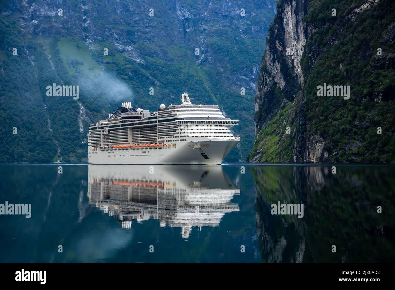 Cruise Ship, Cruise Liners On Geiranger fjord, Norway. The fjord is one of Norway's most visited tourist sites. Geiranger Fjord, a UNESCO World Herita Stock Photo