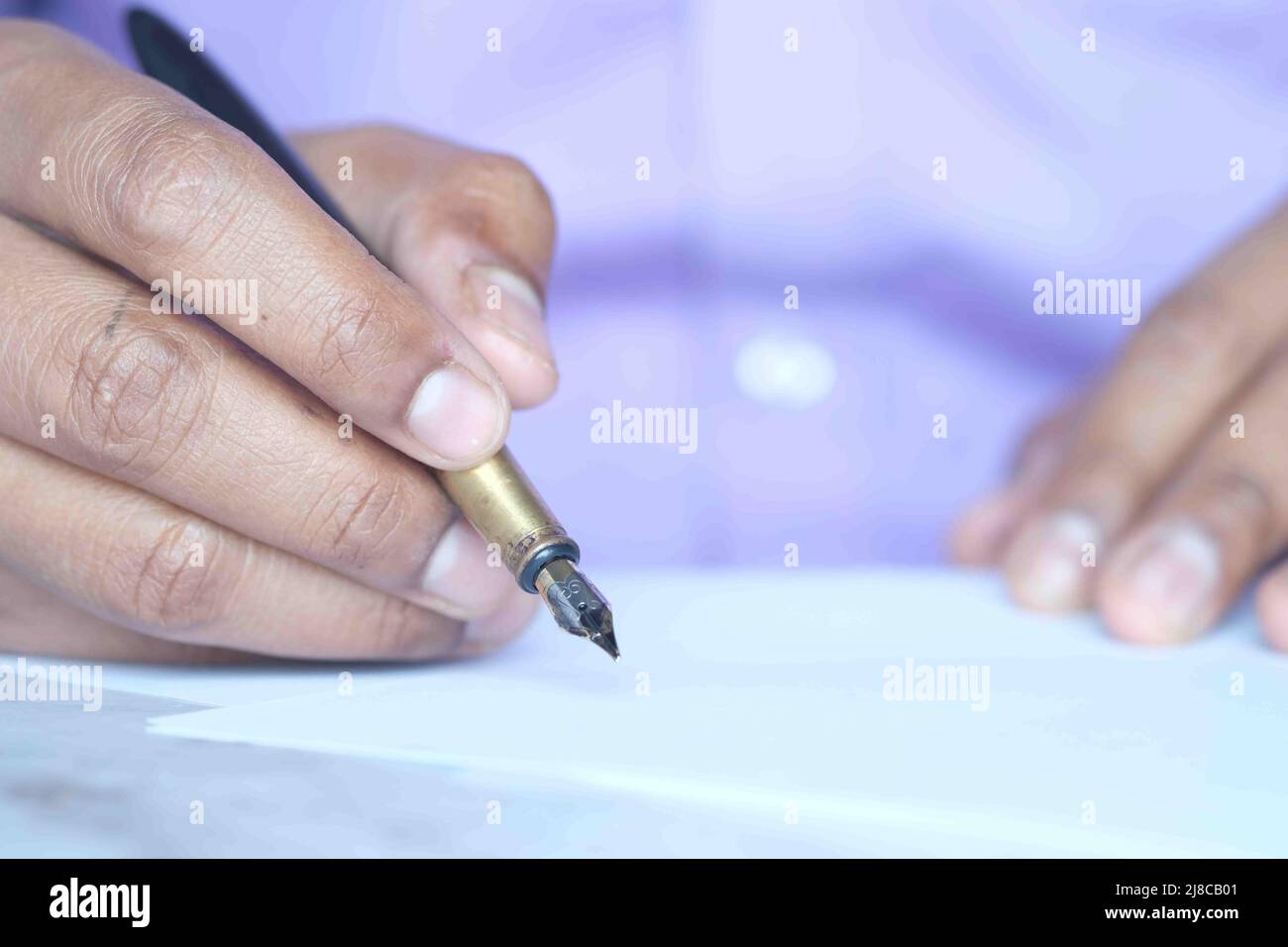 Close up of man hand writing a letter with fountain pen Stock Photo - Alamy