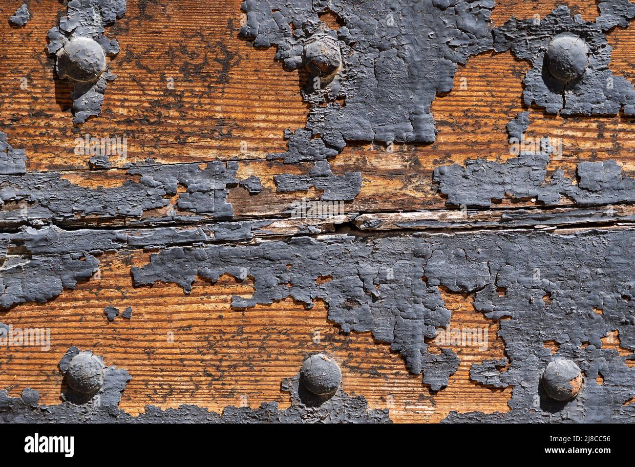 Moisture caused the paint to peel off a wooden door Stock Photo Alamy