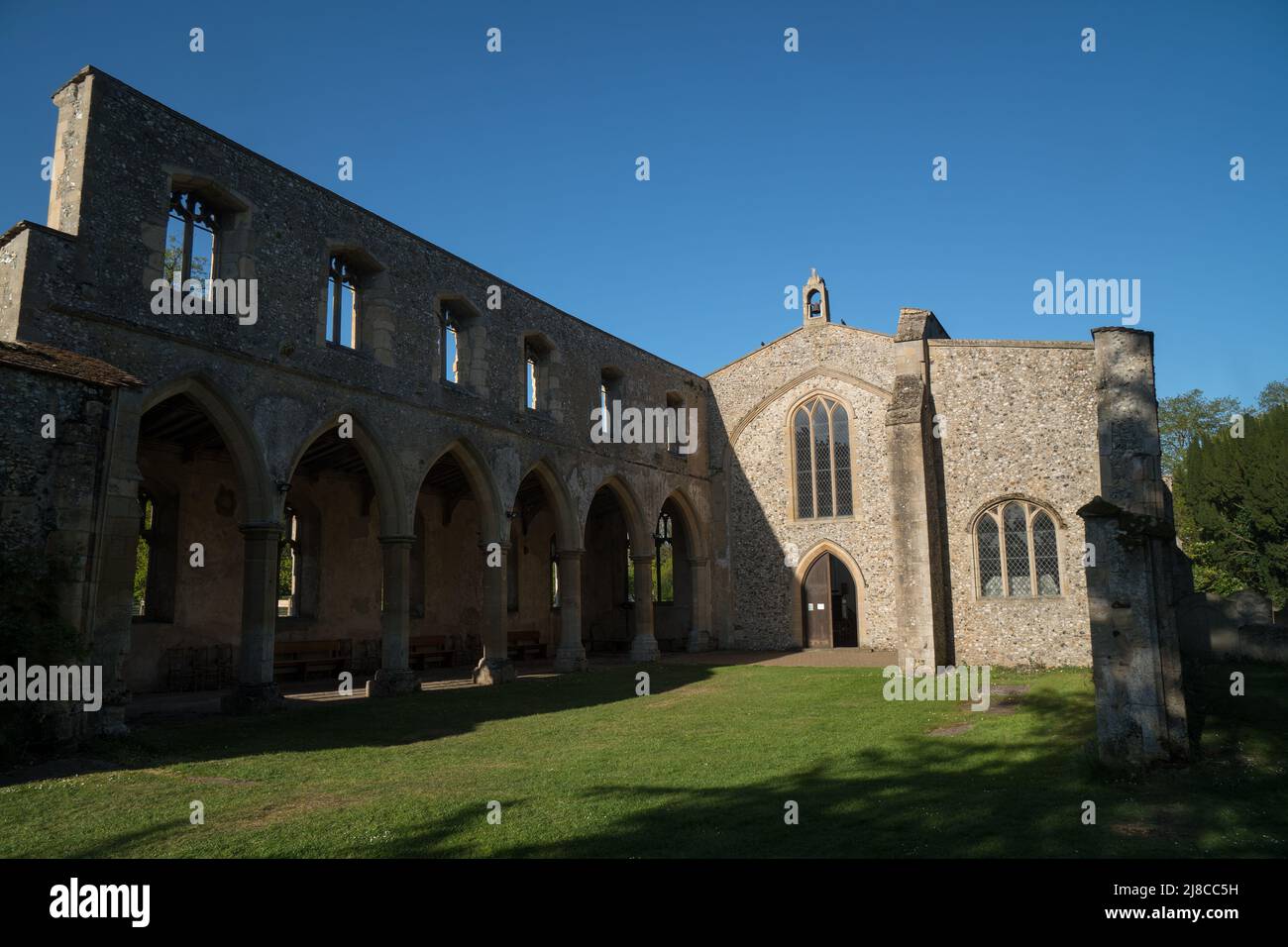 Church of St.John the Evangelist, Oxborough, Norfolk with Chancel and Bedingfield Chapel(right) in background and remaining north aisle of former nave Stock Photo