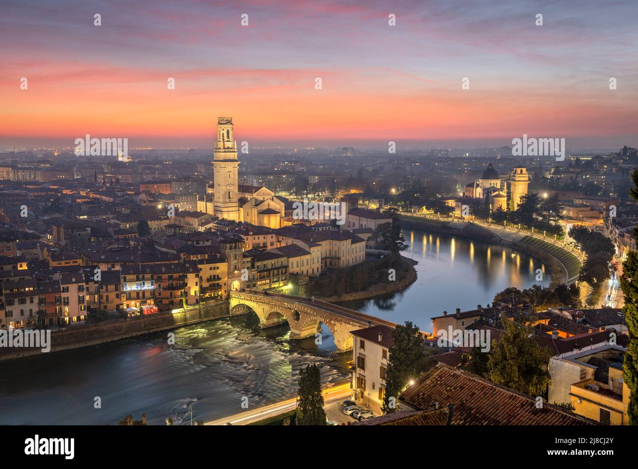 Verona, Italy town skyline on the Adige River at dusk Stock Photo - Alamy