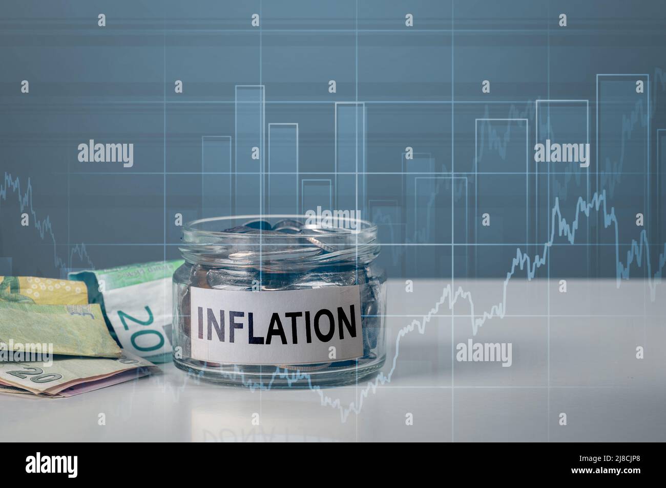 Inflation, tax, cash flow and financial concept. change jar with word inflation. background of graph of rising inflation rates 2023 2022 years Stock Photo