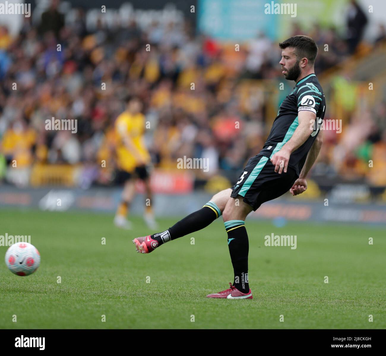 Wolverhampton,  West Midlands, UK. 15th May 2022 ; Molineux Stadium, Wolverhampton,  West Midlands, England; Premier League football, Wolverhampton Wanderers versus Norwich ;   Grant Hanley (C) of Norwich City plays the ball sideways Credit: Action Plus Sports Images/Alamy Live News Stock Photo