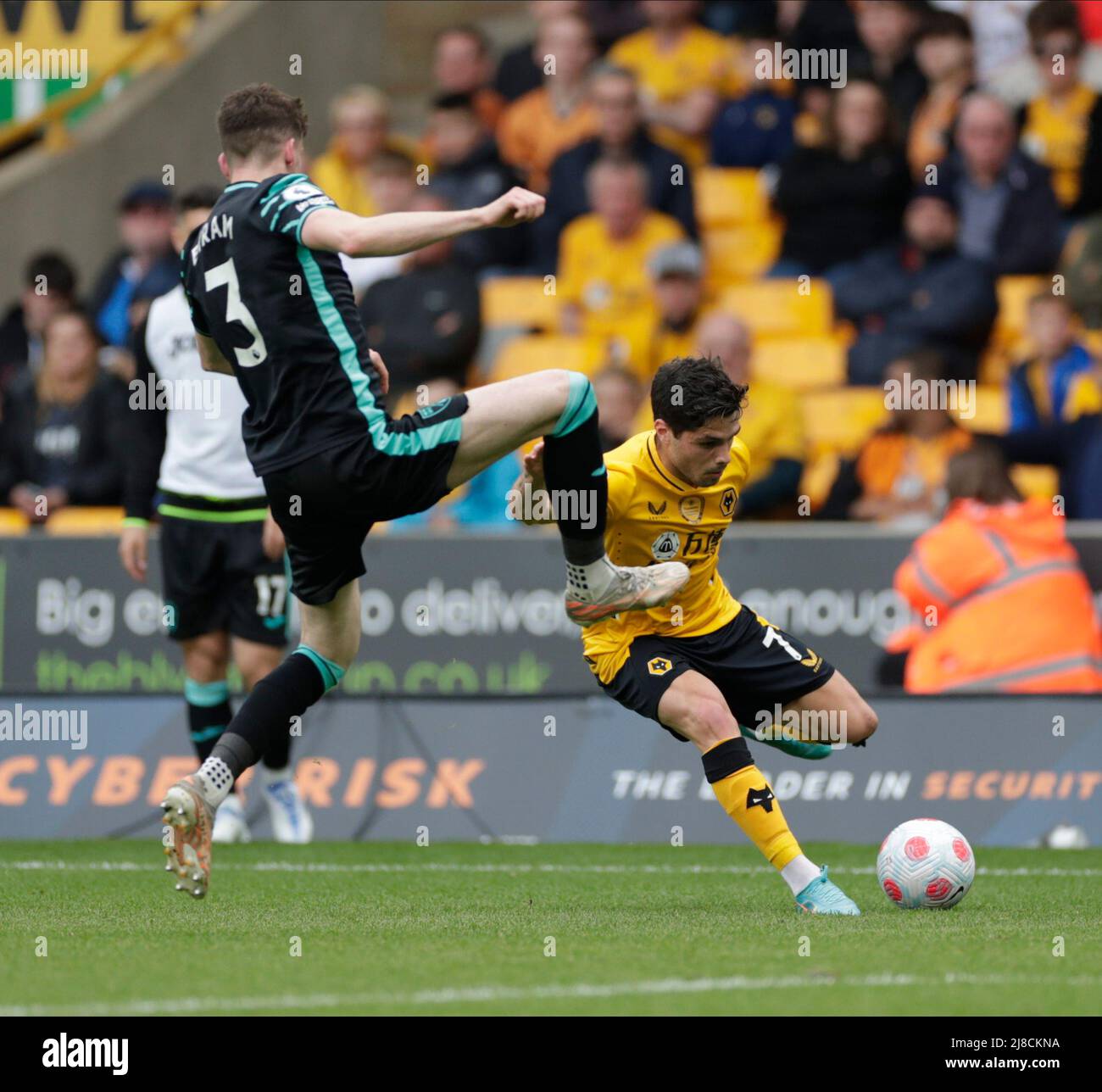Wolverhampton,  West Midlands, UK. 15th May 2022 ; Molineux Stadium, Wolverhampton,  West Midlands, England; Premier League football, Wolverhampton Wanderers versus Norwich ; Sam Byram of Norwich City dives in high on Lomba Pedro Neto of Wolverhamton Wanderers Credit: Action Plus Sports Images/Alamy Live News Stock Photo