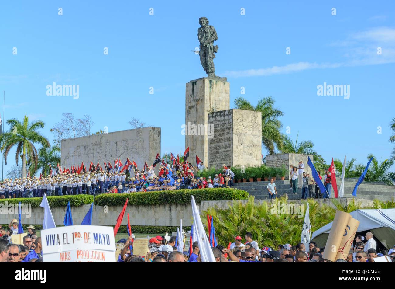 Crowd of people marching by the main tribune. The traditional May Day or Workers Day celebrations are held annually in the Che Guevara Revolution Squa Stock Photo