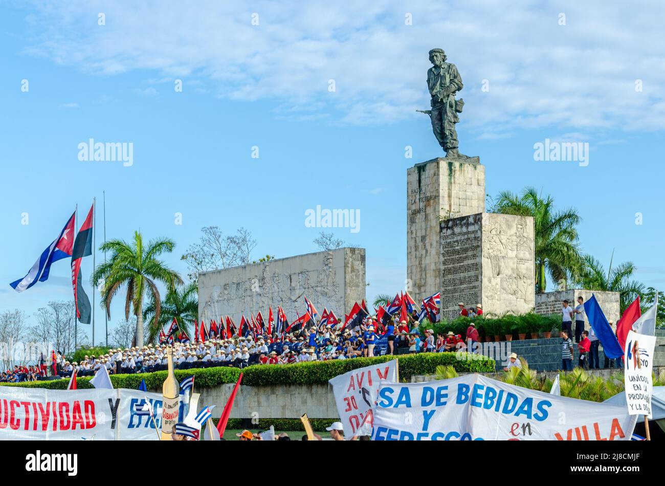 Banners from diverse business crossing the main tribune. The traditional May Day or Workers Day celebrations are held annually in the Che Guevara Revo Stock Photo