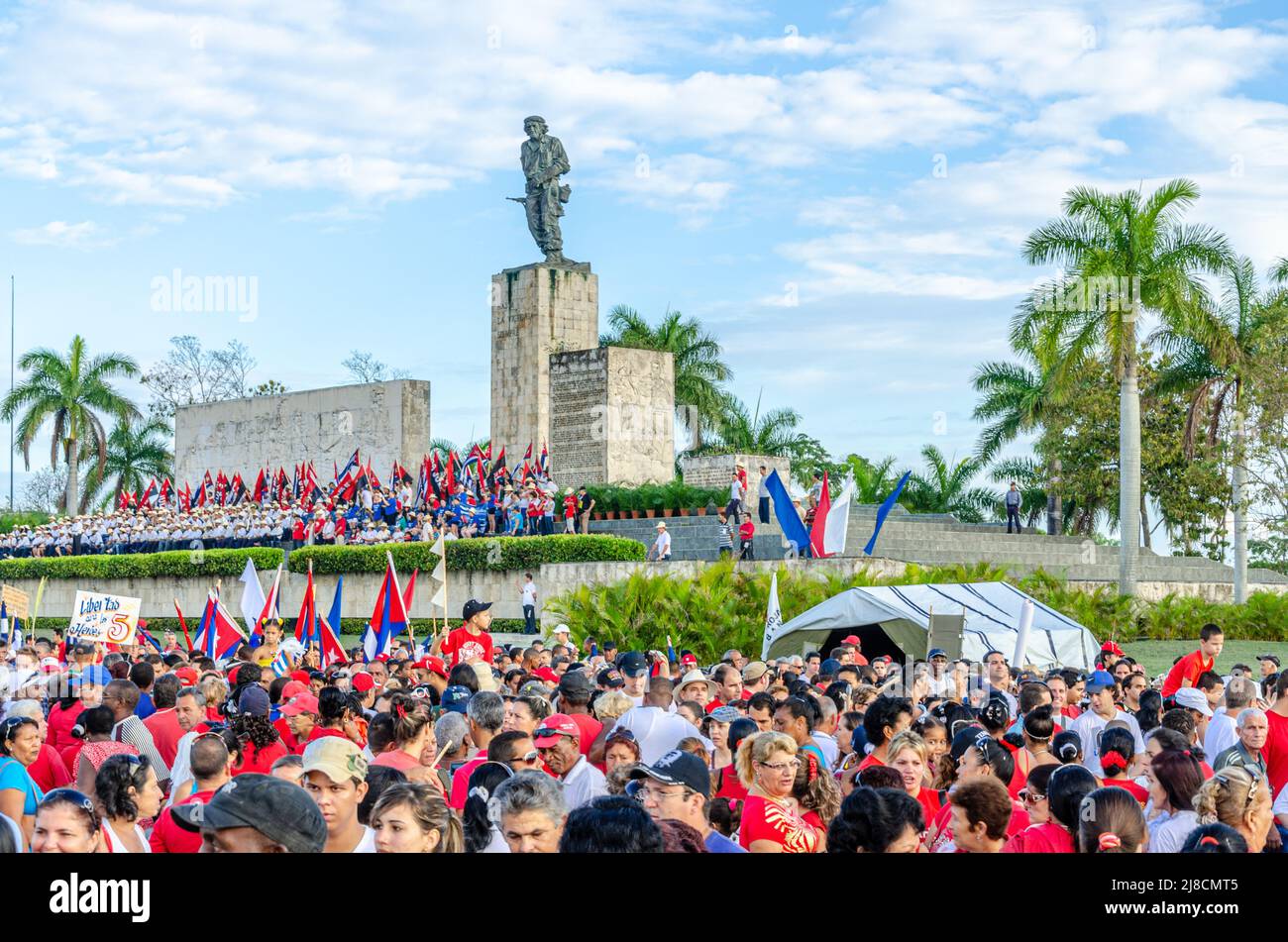 Large group of people parading. The traditional May Day or Workers Day celebrations are held annually in the Che Guevara Revolution Square and Memoria Stock Photo