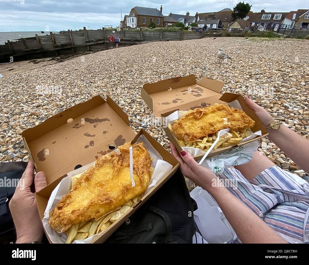 Fish and chips on Whitstable beach in Kent Stock Photo Alamy