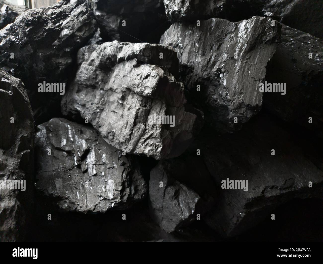 Close-up of black coal stones. fuels and minerals. Background Stock Photo