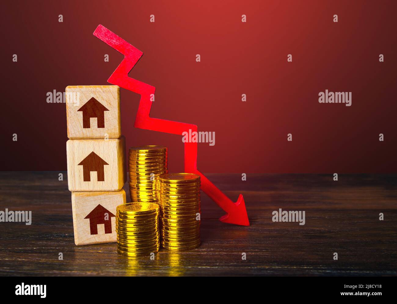 Real estate and red arrow down. Low housing prices. Reduced mortgage rates. Crisis. Maintenance cost. recession. Bankrupt and foreclose. Affordable ho Stock Photo