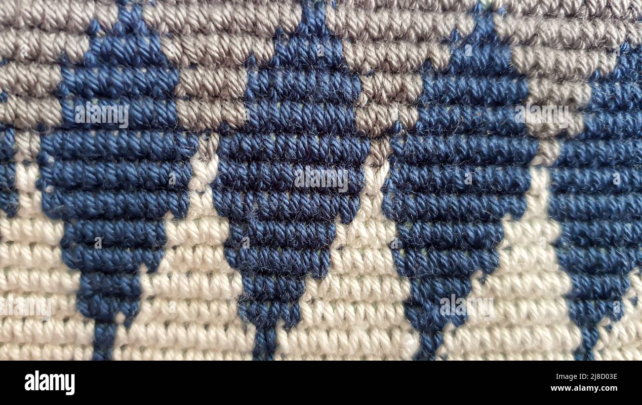 Handmade bags. Knitted from colored threads. Volumetric and comfortable to wear with a long handle. Crochet and knitting. Stock Photo