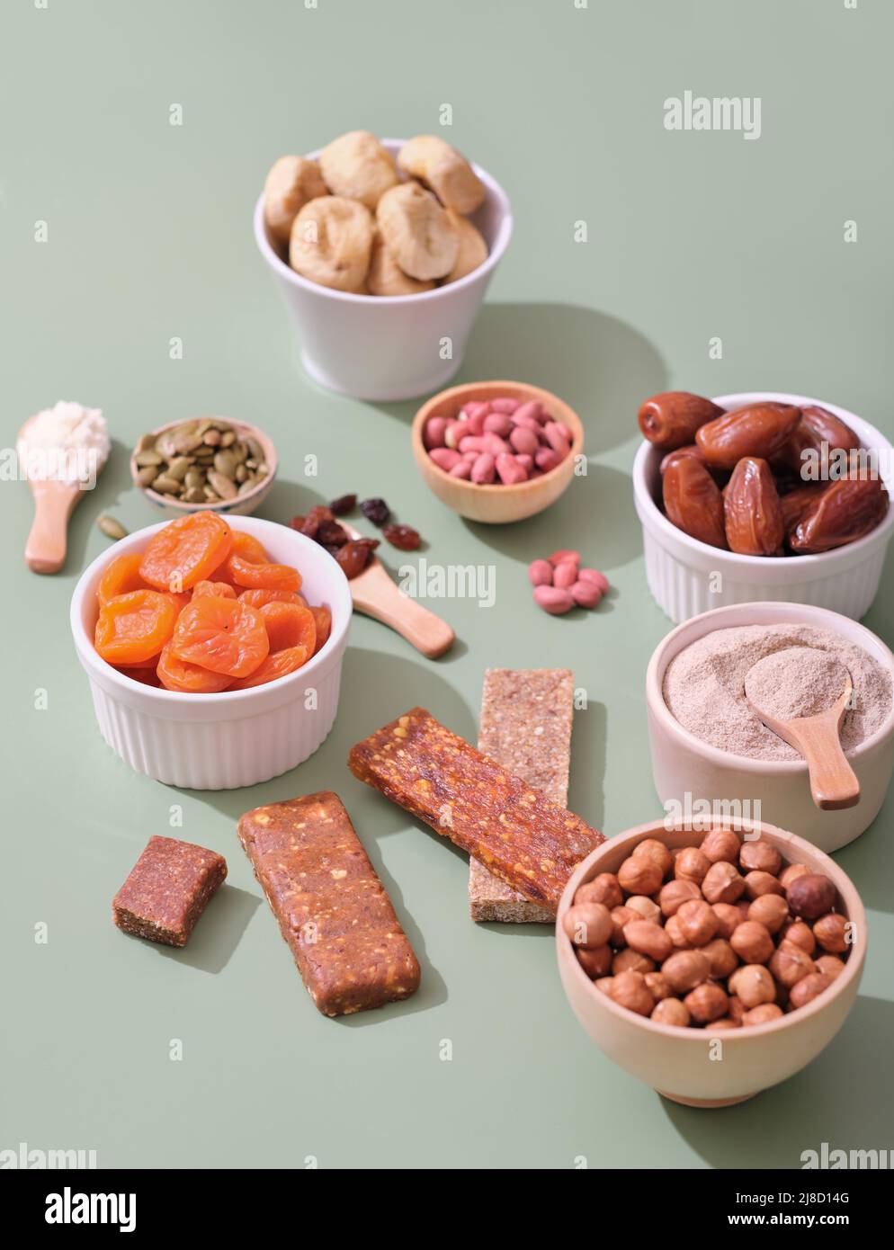 healthy snack, home made energy bars, superfood protein bars with ingredients, vertical. nuts and dry fruits and protein powder Stock Photo