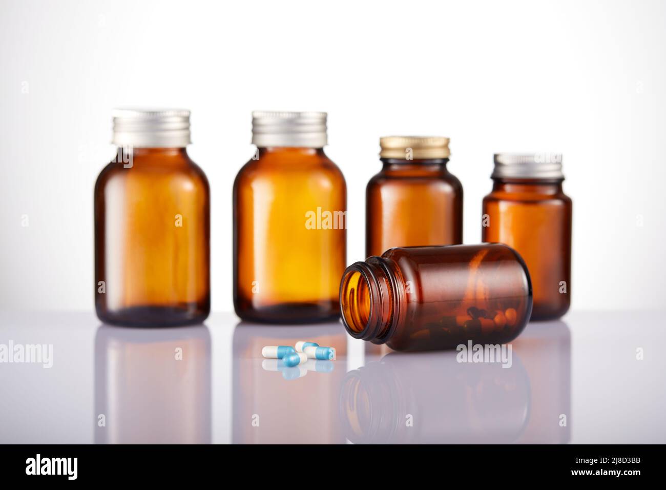 Set of empty brown glass medicine bottles. Amber bottle samples Stock