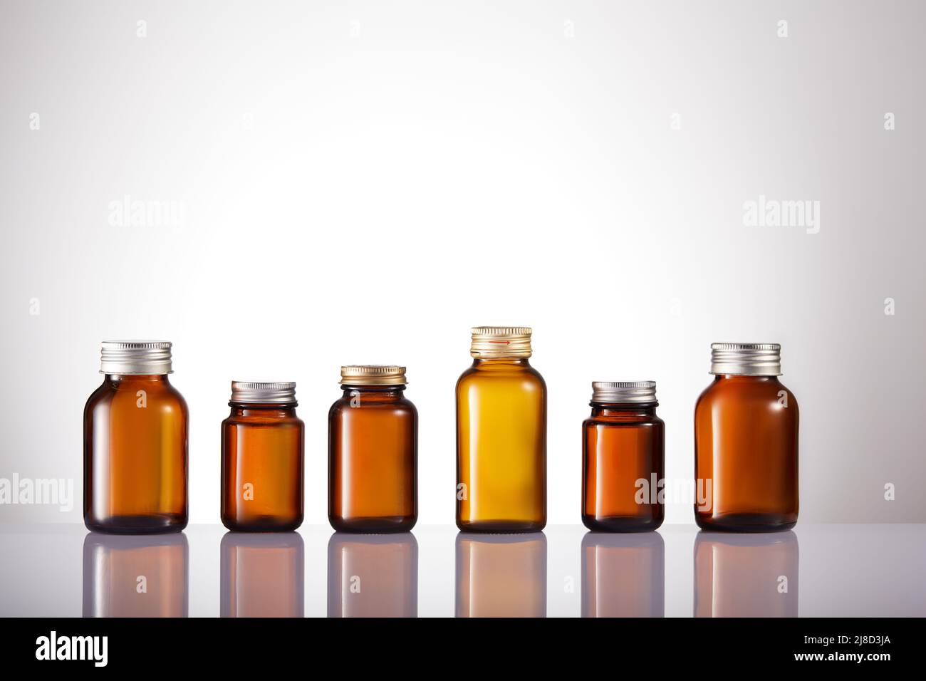 Set of empty brown glass medicine bottles. Amber bottle samples Stock
