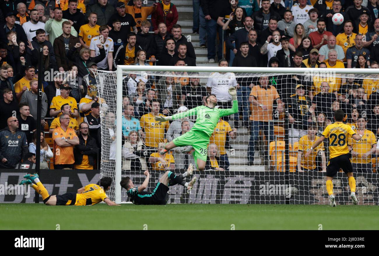 Wolverhampton,  West Midlands, UK. 15th May 2022 ; Molineux Stadium, Wolverhampton,  West Midlands, England; Premier League football, Wolverhampton Wanderers versus Norwich ; Lomba Pedro Neto of Wolverhampton Wanderers header forces a save from  Angus Gunn of Norwich City Stock Photo