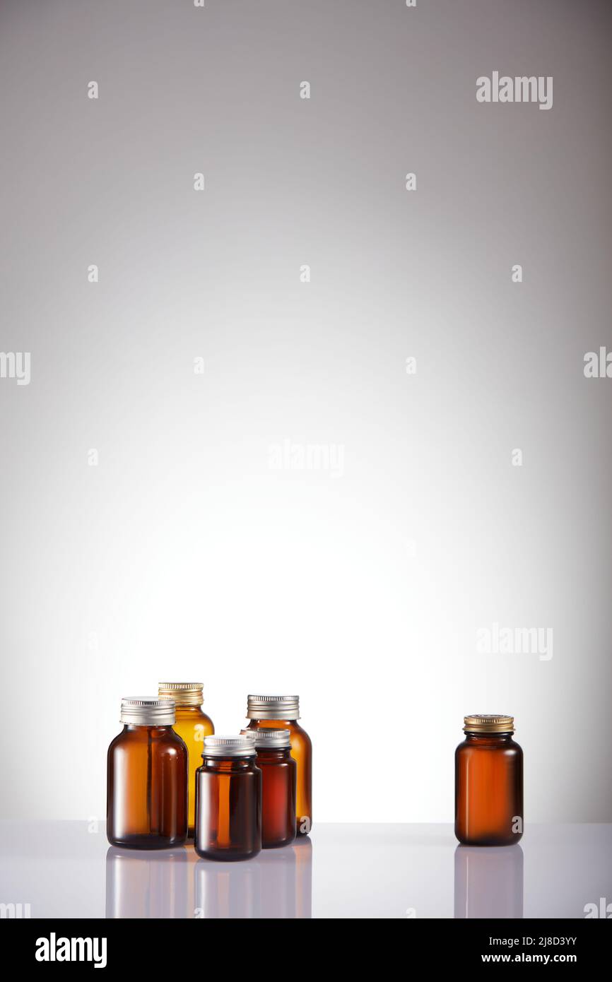 Set of empty brown glass medicine bottles. Amber bottle samples. Stock Photo
