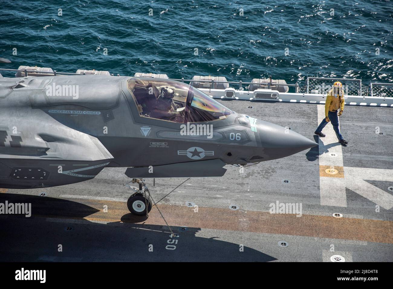 A U.S. Marine Corps F-35B Lightning II fighter aircraft, attached to the Wake Island Avengers of Marine Attack Squadron 211, prepares to take off from the flight deck of the Wasp-class amphibious assault ship USS Essex, March 24, 2021 operating on the Pacific Ocean. Stock Photo