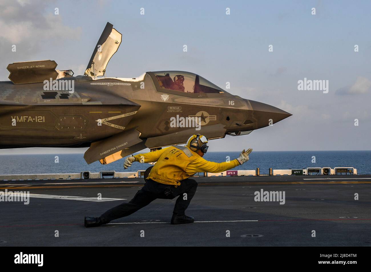 A U.S. Marine Corps F-35B Lightning II fighter aircraft, attached to the Dragons of Marine Medium Tiltrotor Squadron 264, is signaled to take off from the flight deck of the America-class amphibious assault ship USS America during Exercise Cobra Gold 2020, February 29, 2020 operating on the Gulf of Thailand. Stock Photo